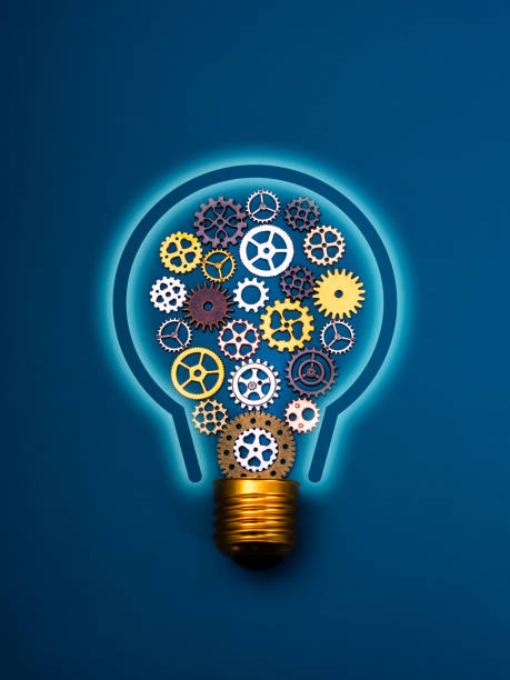 istock Innovation technology and idea management, AI solution, creative, inspiration and innovative idea concept. Many mechanic gears and cogwheels arrange as a light bulb shape on blue vertical background. 2186642114
