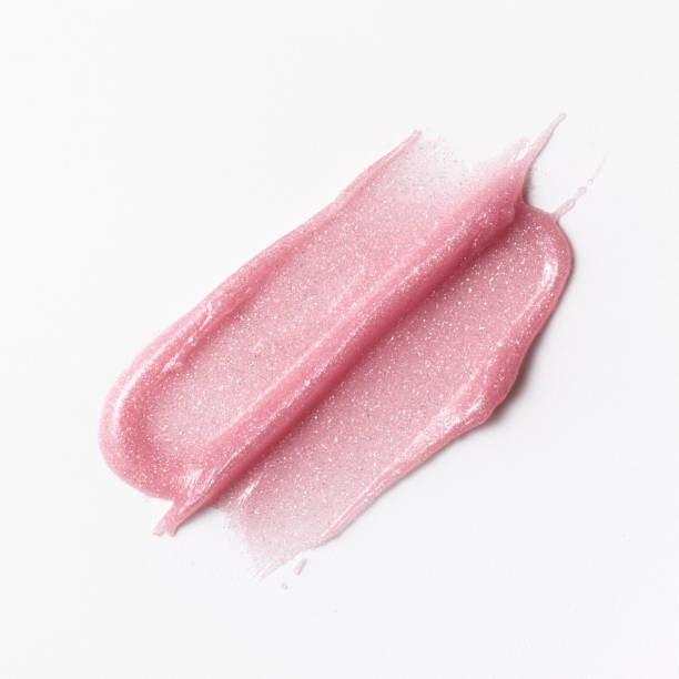istock Pink shimmering lipgloss texture isolated on white background 2186647163