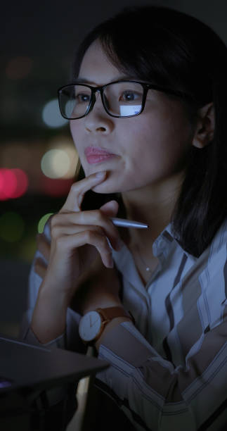 istock business woman work at night 2186649505