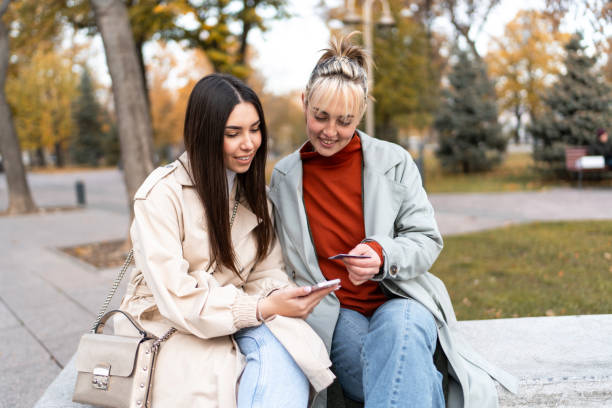 istock Young women having fun while shopping online 2186649560
