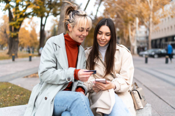 istock Young women having fun while shopping online 2186649586