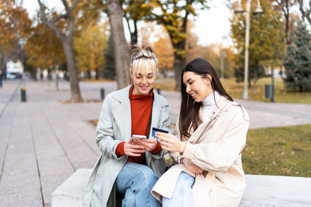 istock Young women having fun while shopping online 2186649911