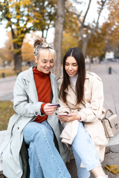 istock Young women having fun while shopping online 2186650600