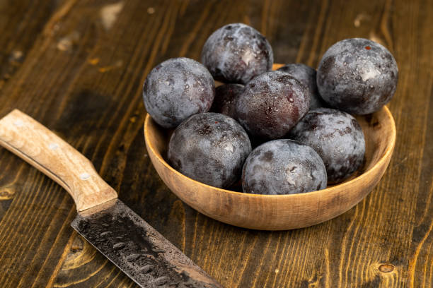 istock purple plums on the table during cooking 2186650774