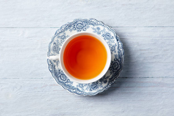 istock Tea in white cup. Grey wooden background. Close up. Top view. 2186655731