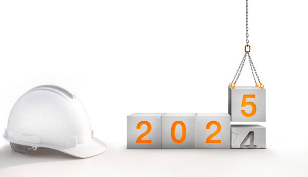 istock Happy New Year 2025 Construction and Industry. White Helmet and a numbered concrete cube white background 2186656439