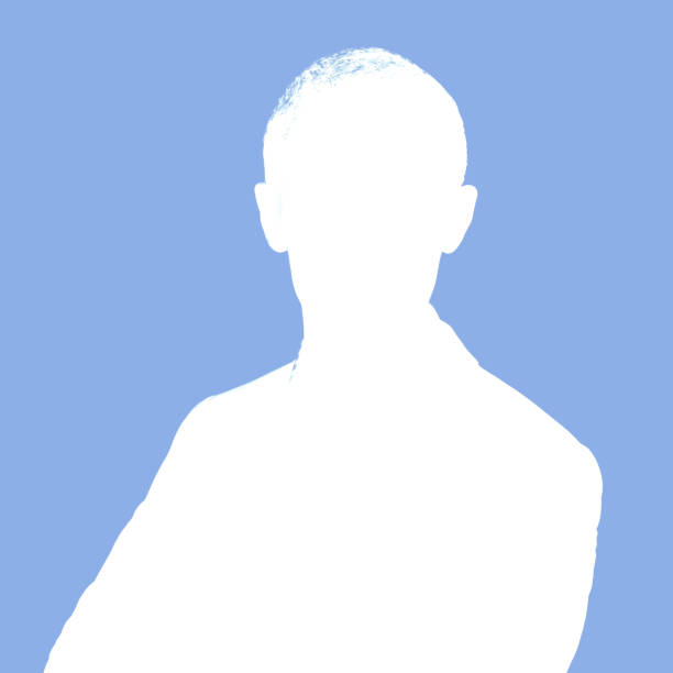 side silhouette of a man walking and dressed in a suit looking at camera on white background
