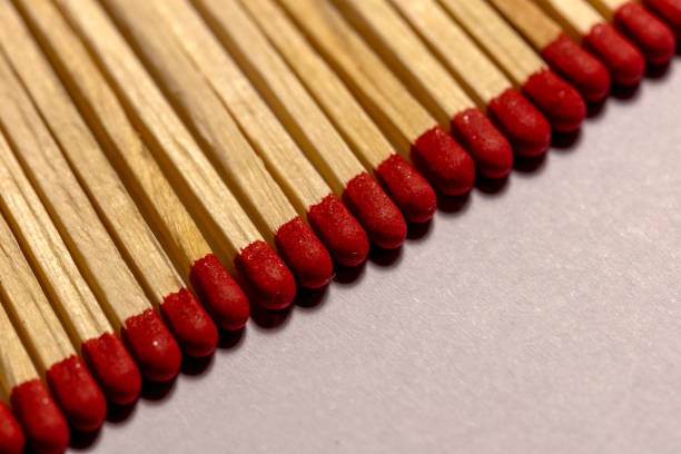 Close-Up Of Matchsticks Over White Background