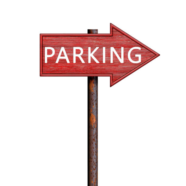 istock Red wooden arrow sign with parking inscription on rusty pole. Direction pointer to the right. Signboard isolated on white 2186659438