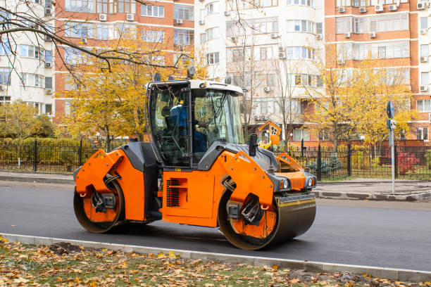 istock Compacting a new layer of asphalt with a roller. A vibratory roller is used in road construction. 2186660348