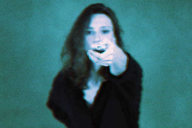 Technology, television and media concept. A young woman with a remote control aimed forward. Blue digital glitch effect
