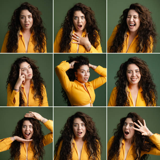Young woman making different facial expressions, studio shot