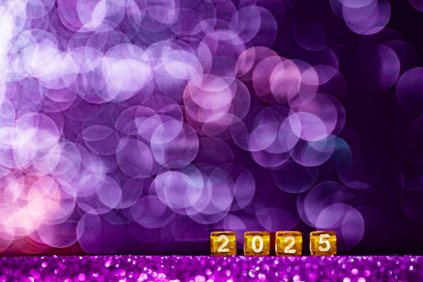istock Glamorous New Year 2025 setup featuring small golden dice with white numbers forming 2025 placed against a shimmering purple glitter background 2186661460
