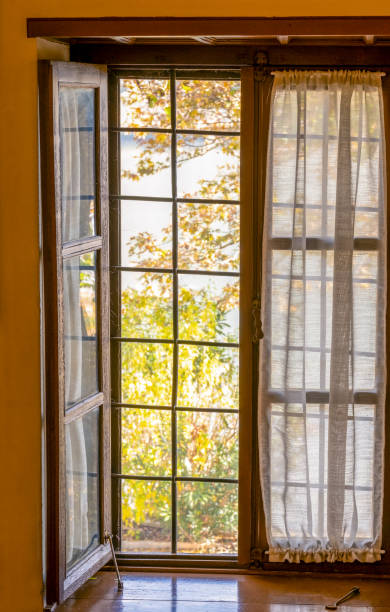 istock The open window with the autumn lake view 2186663726