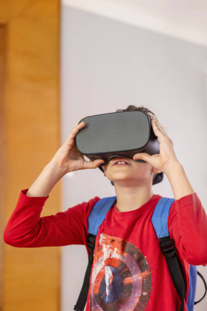 istock Child exploring history through virtual reality. VR glasses in education and technology 2186665229