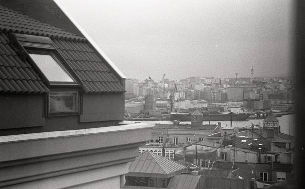 istock ROOFTOPS AND CITY FROM THE WINDOW 2186667886