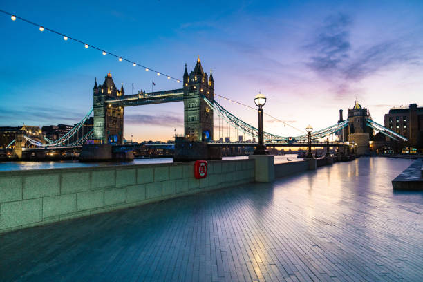 istock London tower bridge and river Thames illuminated at evening 2186669414
