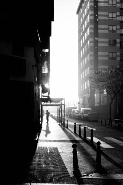 istock MAN CLEANING THE STREET WHILE THE SUN GOES DOWN 2186675333