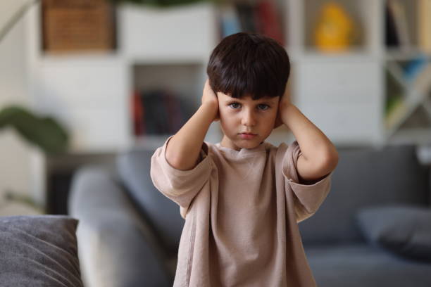 istock Little boy covering his ears with hands 2186675609