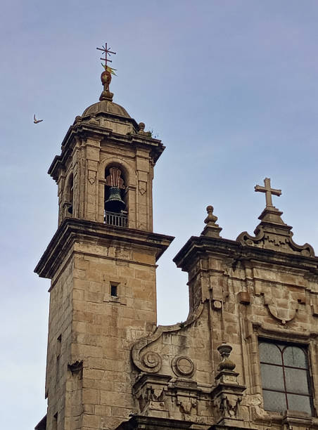 istock CHURCH WITH BELL TOWER OVER BLUE SKY AND FLYING SEAGULL 2186678222