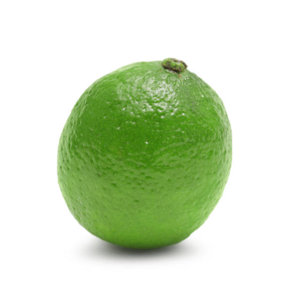 istock Fresh ripe lime with green leaves isolated on white 2186678915