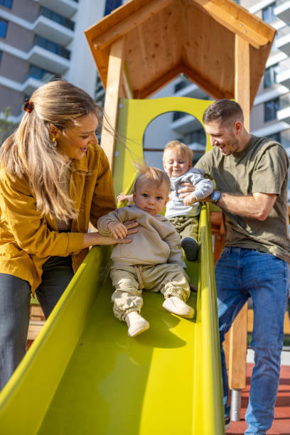 istock Sliding Fun with Mom and dad 2186678958