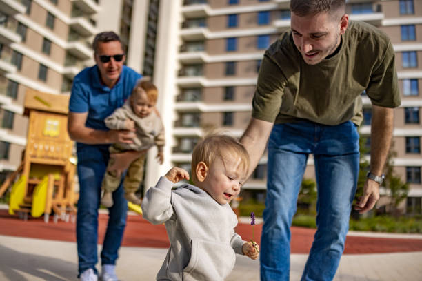istock Two Dads and Their Kids at playground 2186680057