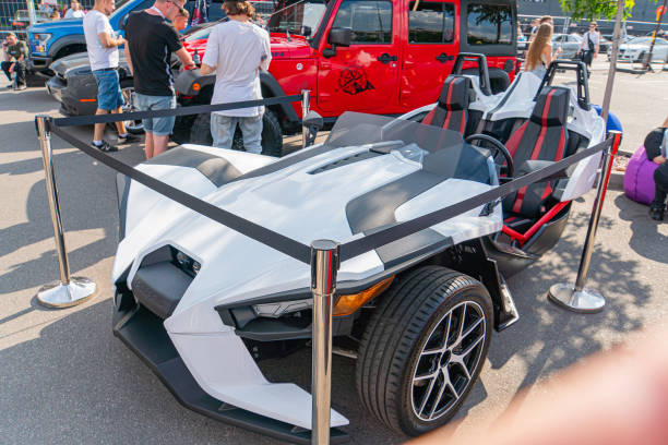 A futuristic, angular vehicle is displayed at an outdoor exhibition, with a protective barrier surrounding it The vehicle features sharp edges and an Kyiv, Ukraine 06-06-2024
