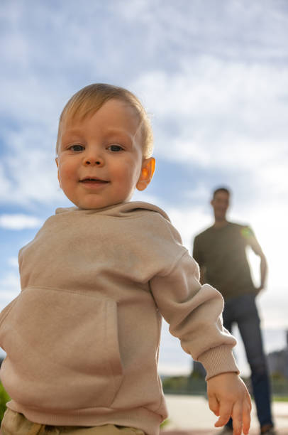 istock Cheerful Toddler running away from his dad 2186681017