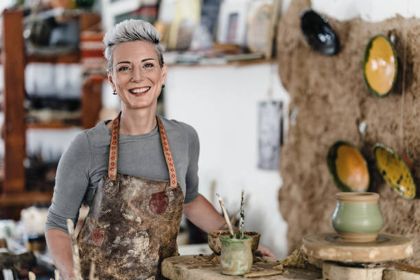 istock Portrait of a beautiful female potter in art studio 2186682425