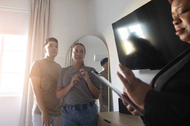 istock real estate agent showing house 2186685913