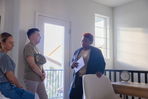 istock real estate agent showing house 2186685971