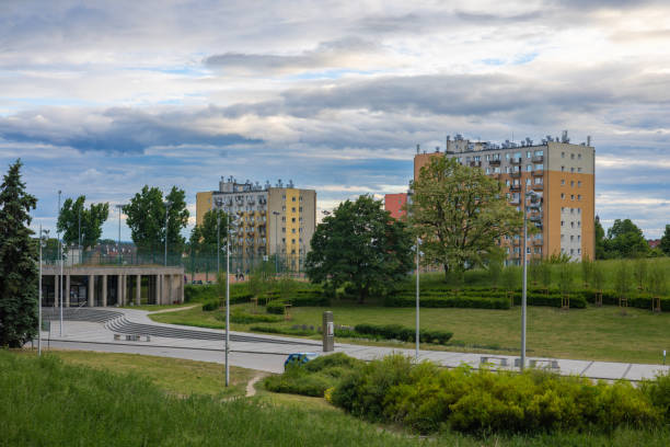 istock A city park with trees, a path, and multi-storey buildings in the background. 2186686154