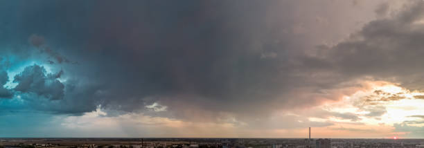 istock Aerial drone panoramic view of qmazing colourful dramatic sky with clouds before rain starts, blue and red orange sunset 2186687061