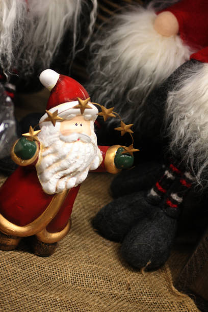 istock A Santa clause decoration with stars in his hands 2186689987