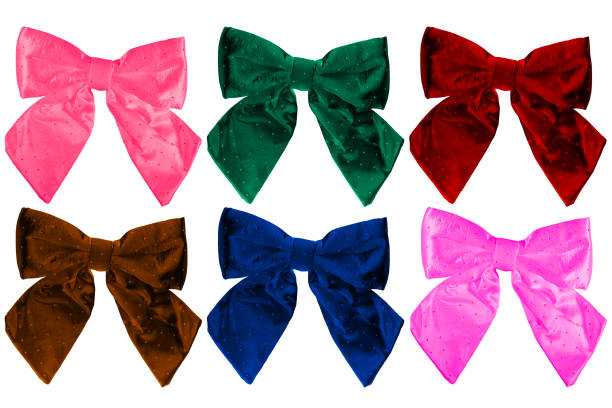 Six large decorative bows are a different color and have a slightly shiny texture with small dots. Isolated on white background. Suitable for various decorative purposes such as gift wrapping, fashion accessories, or festive decorations.