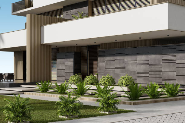 istock Modern Condominium Building with Apartments with Large Windows, Terraces, and Lush Greenery 2186691543