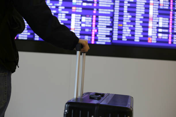 istock Man hand touching baggage in international airport. 2186692680