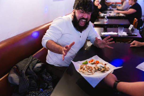 istock Gay couple eating at restaurant 2186692769