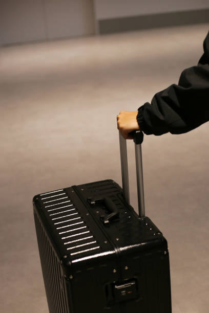 istock Man hand touching baggage in international airport. 2186693493