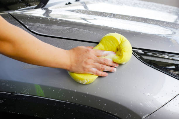 istock Washing car with yellow sponge 2186693511