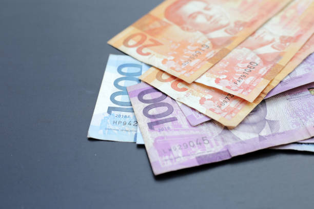 istock Philippine money, Banknotes on dark background. 2186693662