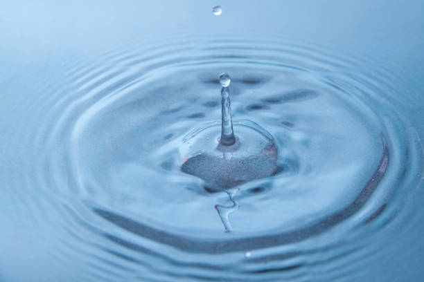 istock A long drop of water froze over the blue surface 2186697739