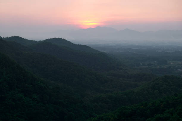 landscape view of sunset over the green mountains