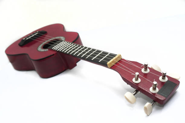 Close-Up Of Ukulele Against White Background