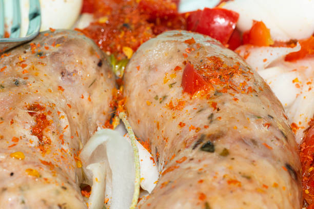 Argentinian sausages with pepper and onion , on the plate