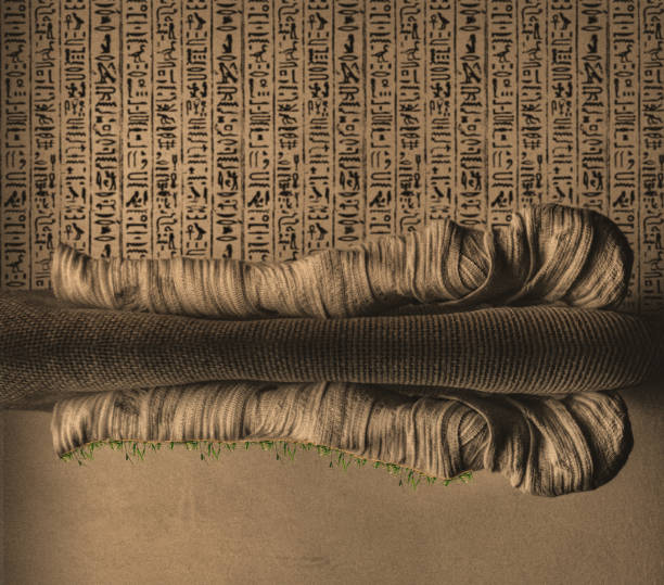 Conceptual photo of an Ancient Egyptian mummy, partially wrapped in aged bandages, set against mysterious hieroglyphic scripts symbolizing guidance for the afterlife. A tribute to ancient beliefs