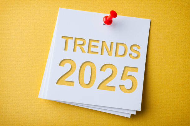 istock Trends 2025 Word in White Sticky Note on Yellow Cardboard Background 2186707042
