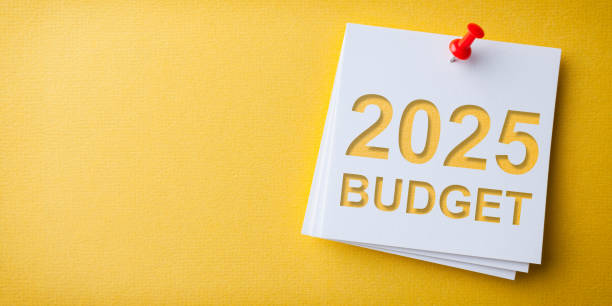 istock Budget 2025 Word in White Sticky Note on Yellow Chardboard Background 2186707044