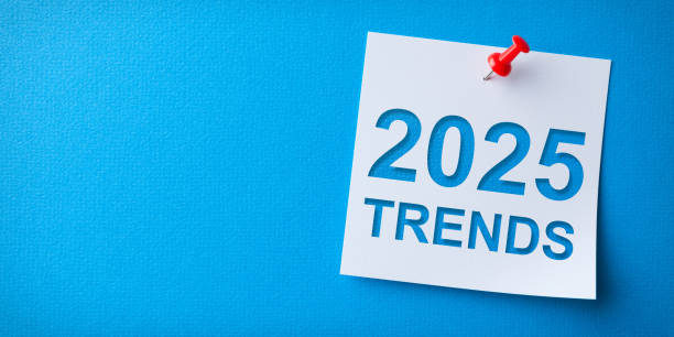 istock Trends 2025 Word in White Sticky Note on Blue Cardboard Background 2186707124